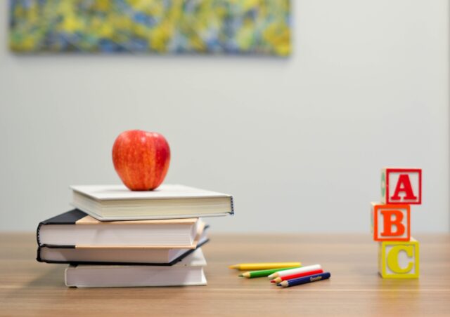 school books and pencils on table