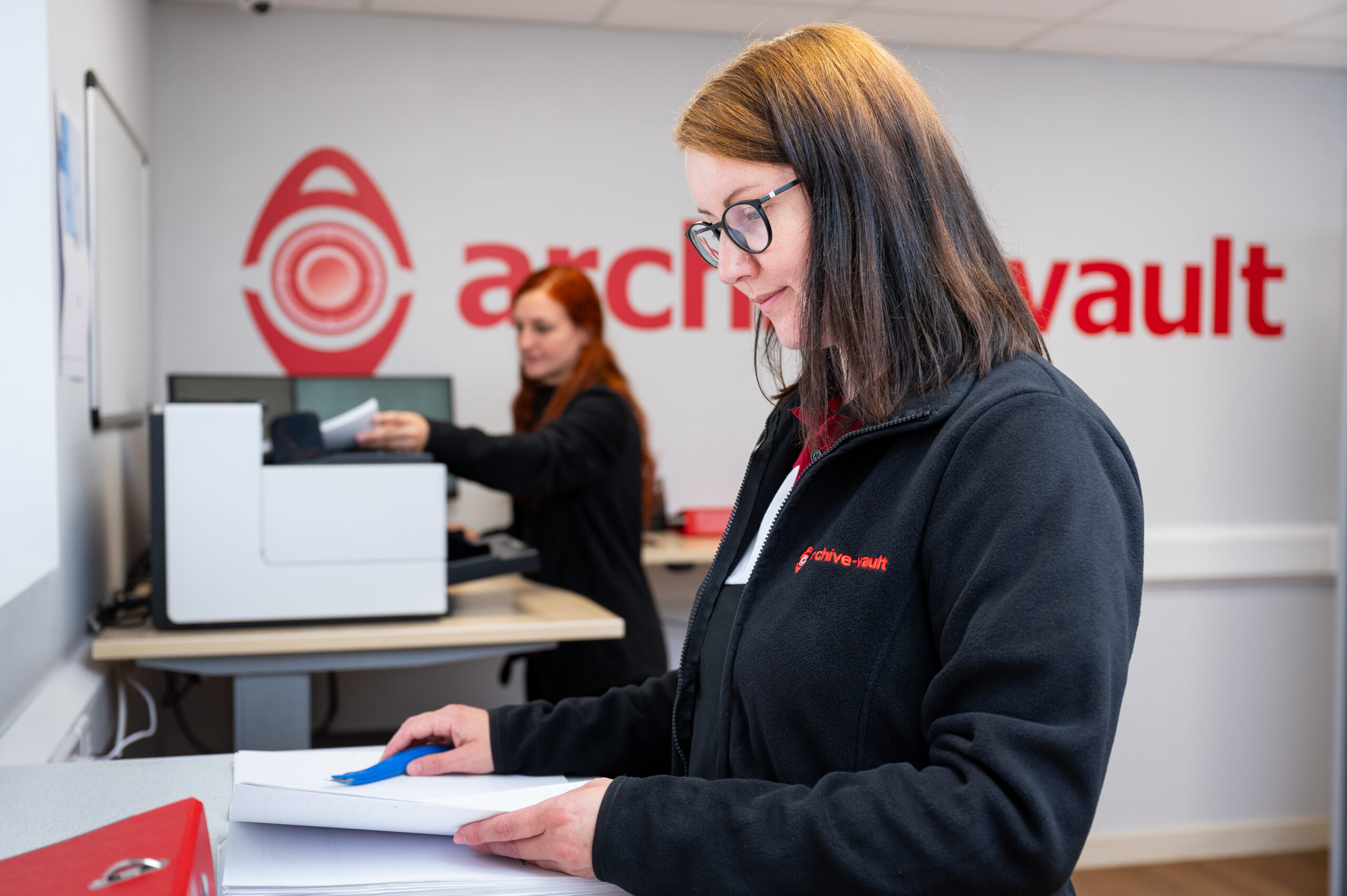 employee preparing and scanning documents