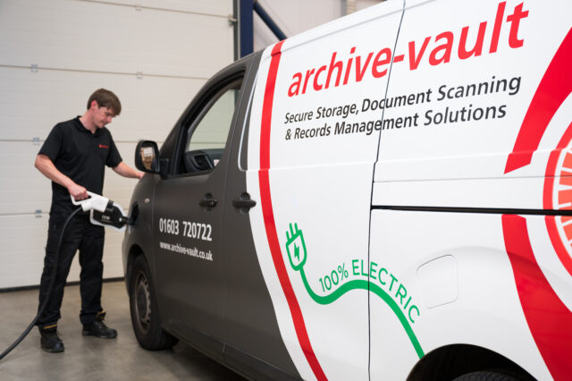 employee charging electric van