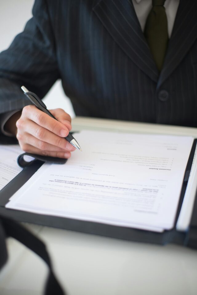 Man signing document