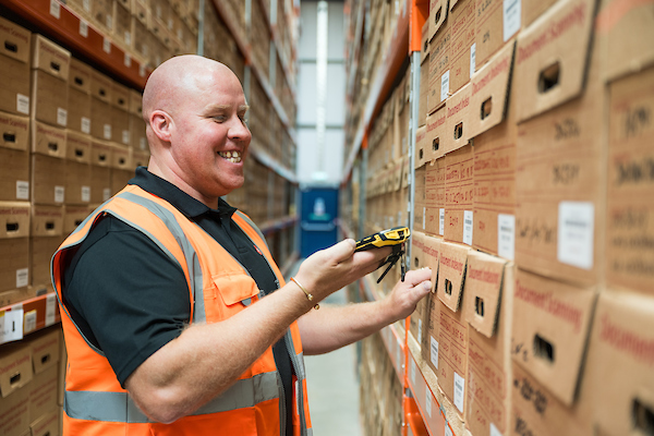 Archive Vault employee scanning storage boxes